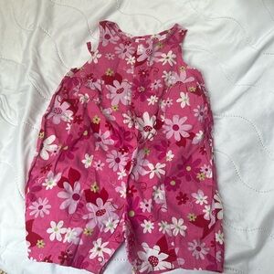 Baby girls pink flowered summer romper.